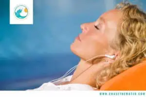 headphones for swimming woman relaxing on beach
