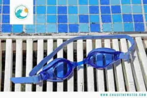 swimming goggles by pool