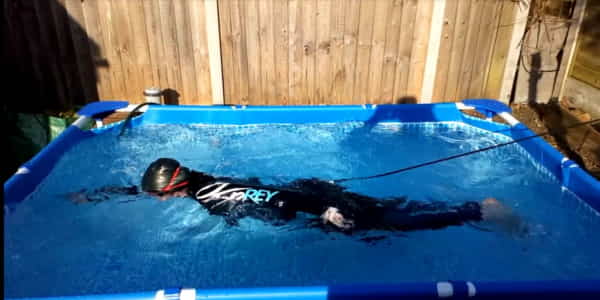 swimmer in a small garden pool