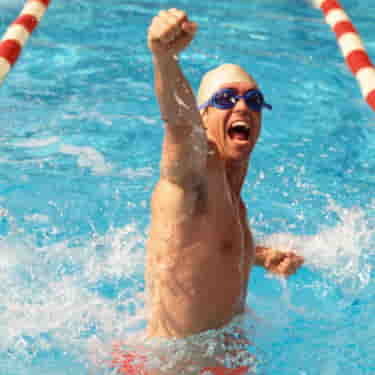 a swimmer celebrates a fast swim time
