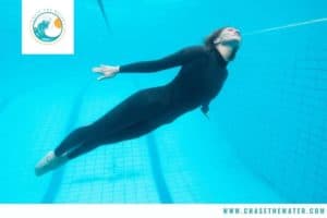 diver wearing a wetsuit in a swimming pool
