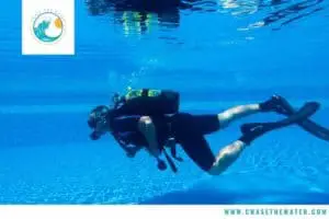 diver training in wetsuit in pool