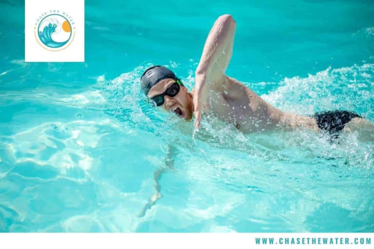 a male swimmer is swimming sprints